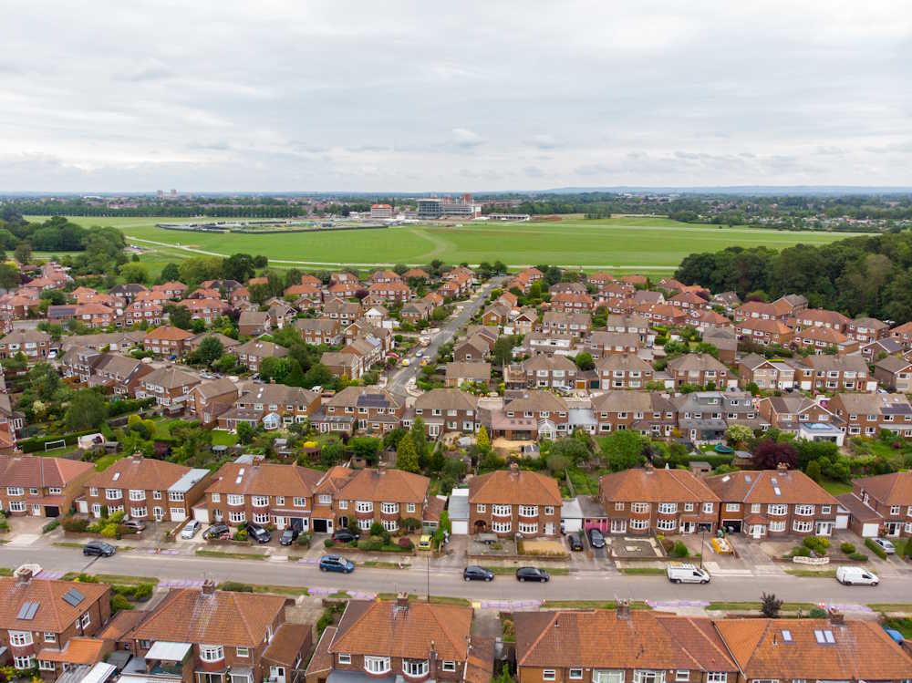 An aerial photograph above a residential area of a town